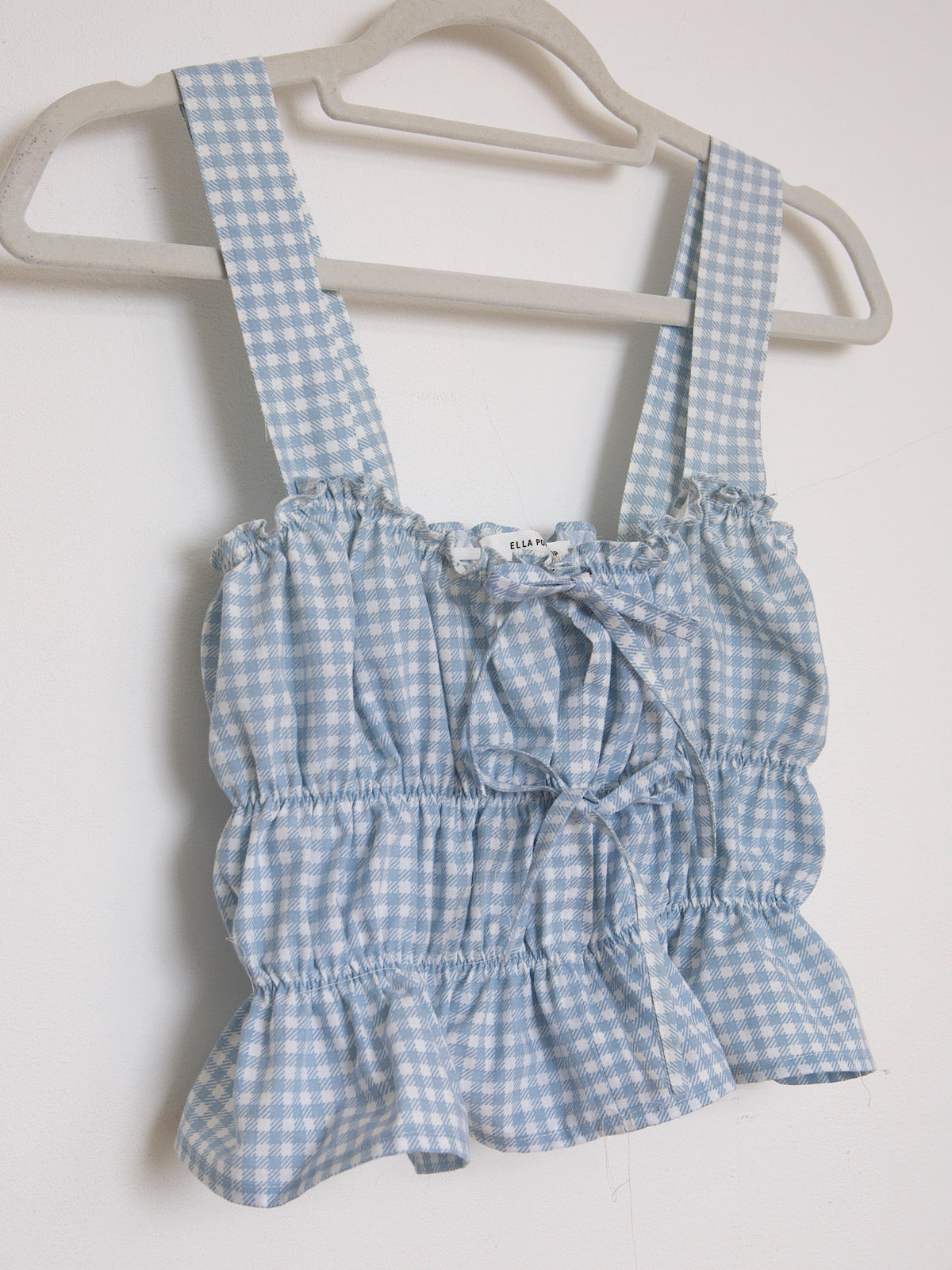 Blue gingham crop top with shoulder traps and front bows