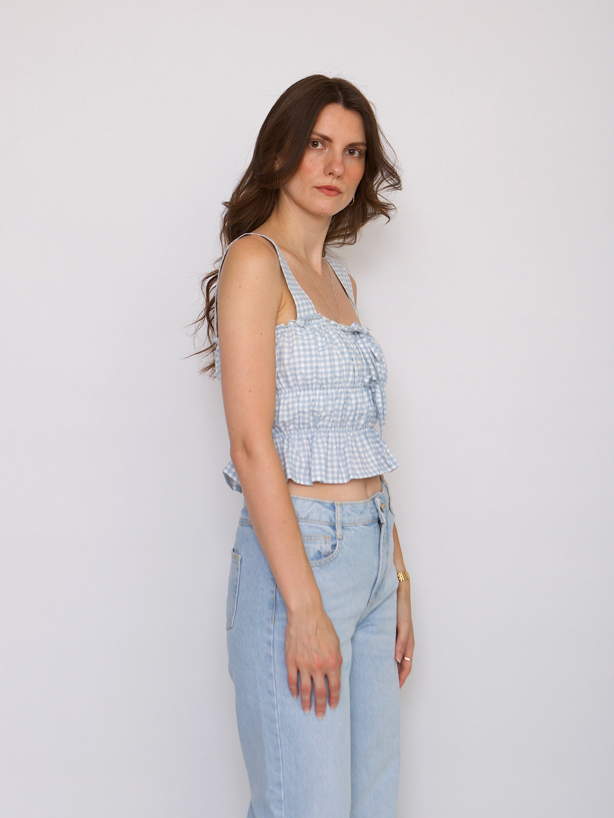 Blue gingham crop top with shoulder traps and front bows