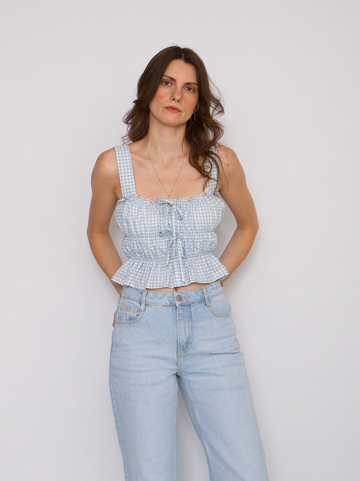 Blue gingham crop top with shoulder traps and front bows