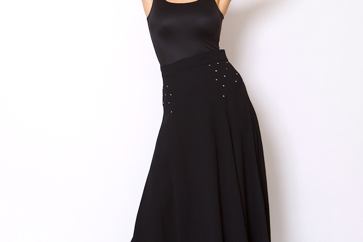 Woman wearing a black evening gown with a white background