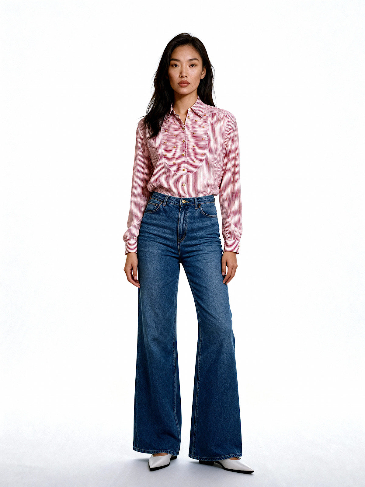 Vintage Escada silk shirt with red and white stripes and gold buttons, styled with high-waisted wide-leg jeans.