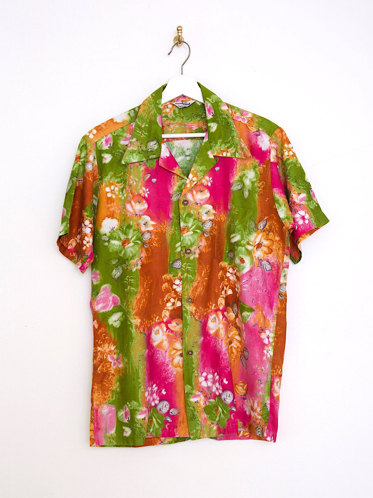 60s vintage clothing bright floral print cotton Hawaii shirt with green, orange, and pink stripes.